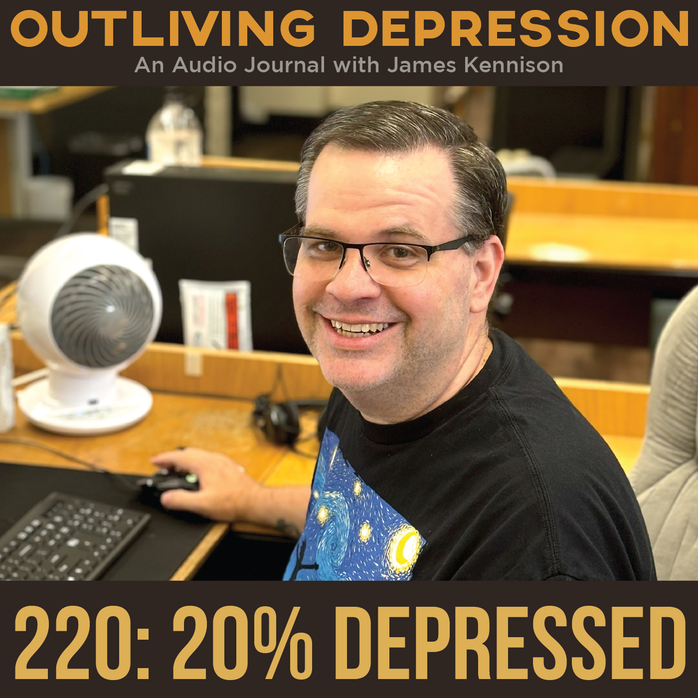 220: 20% Depressed. James sitting at his desk at work smiling at the camera.